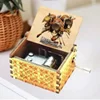 Hand-cranked music box, retro engraving, exquisite painting, attacking giants, the same creative ornament, wooden music box 1