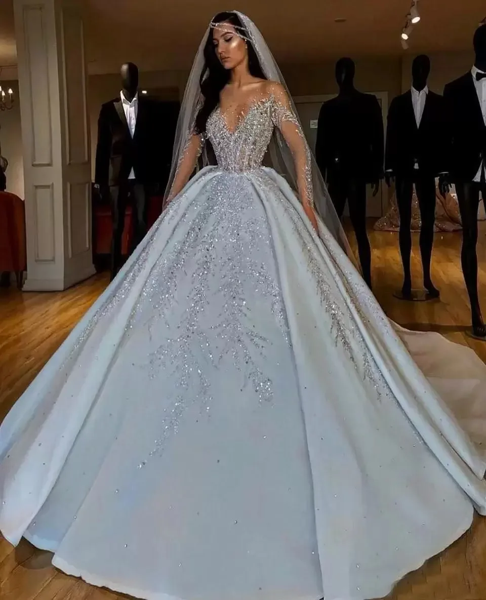 

Arabic Crystals Sequins Wedding Dresses Ball Sheer Long Sleeves Bling Sparkly Dubai Garden Bridal Gowns Court Train