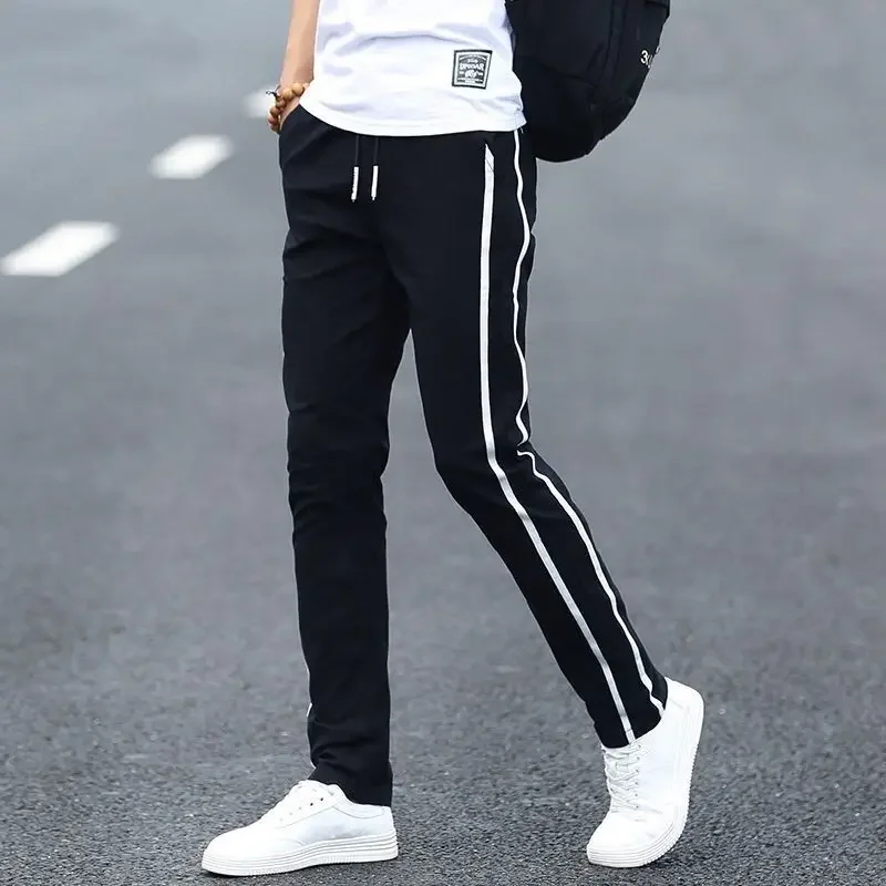 thumbnail image 1 of Pantalones casuales blancos rotos de tendencia para hombre, pantalones ajustados de moda para hombre, novedad en ropa de calle holgada, elegante, de algodón con bolsillos anchos, 1 of 5