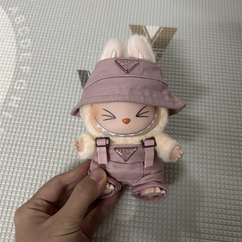 🧢👖 Cute Meets Classic – Mini Style for Your Labubu Give your Labubu V1/V2 plush doll a fresh new look with this 15–17cm Outfit & Accessories Set. Including a pair of adorable mini overalls and a matching hat, this set adds instant charm and personality to your plush collection. 🎁 Ideal as a birthday gift, collector’s item, or display piece, this outfit makes your plush doll stand out in any collection or scene. ✨ What’s Inside: Custom-sized for 15–17cm Labubu V1/V2 dolls Includes: stylish overalls + cute mini hat Made from soft, durable, and doll-safe materials Easy to put on and remove for play, decoration, or photos Great for Kawaii lovers, Labubu fans, and collectors 🔔 Note: This is a custom-made product and not officially affiliated with Labubu or Pop Mart.