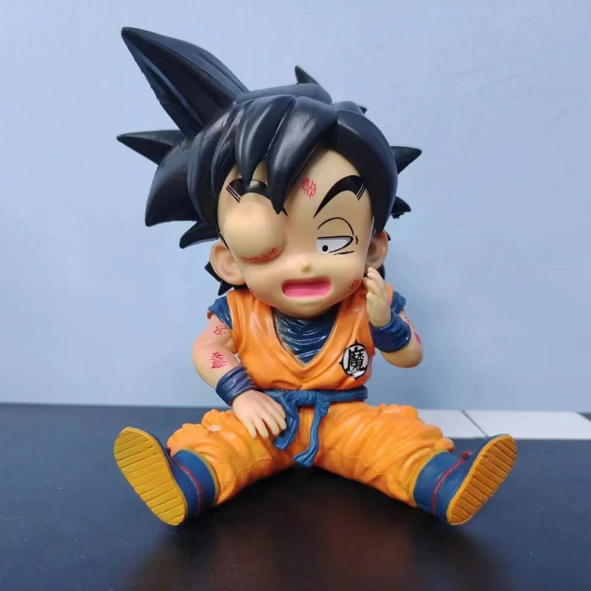 

10.5CM Dragon Ball Q Version Sitting Swollen eyes one-eyed Goku Statue Anime Figurine Pvc Model Doll Collection Toy Gift Kids