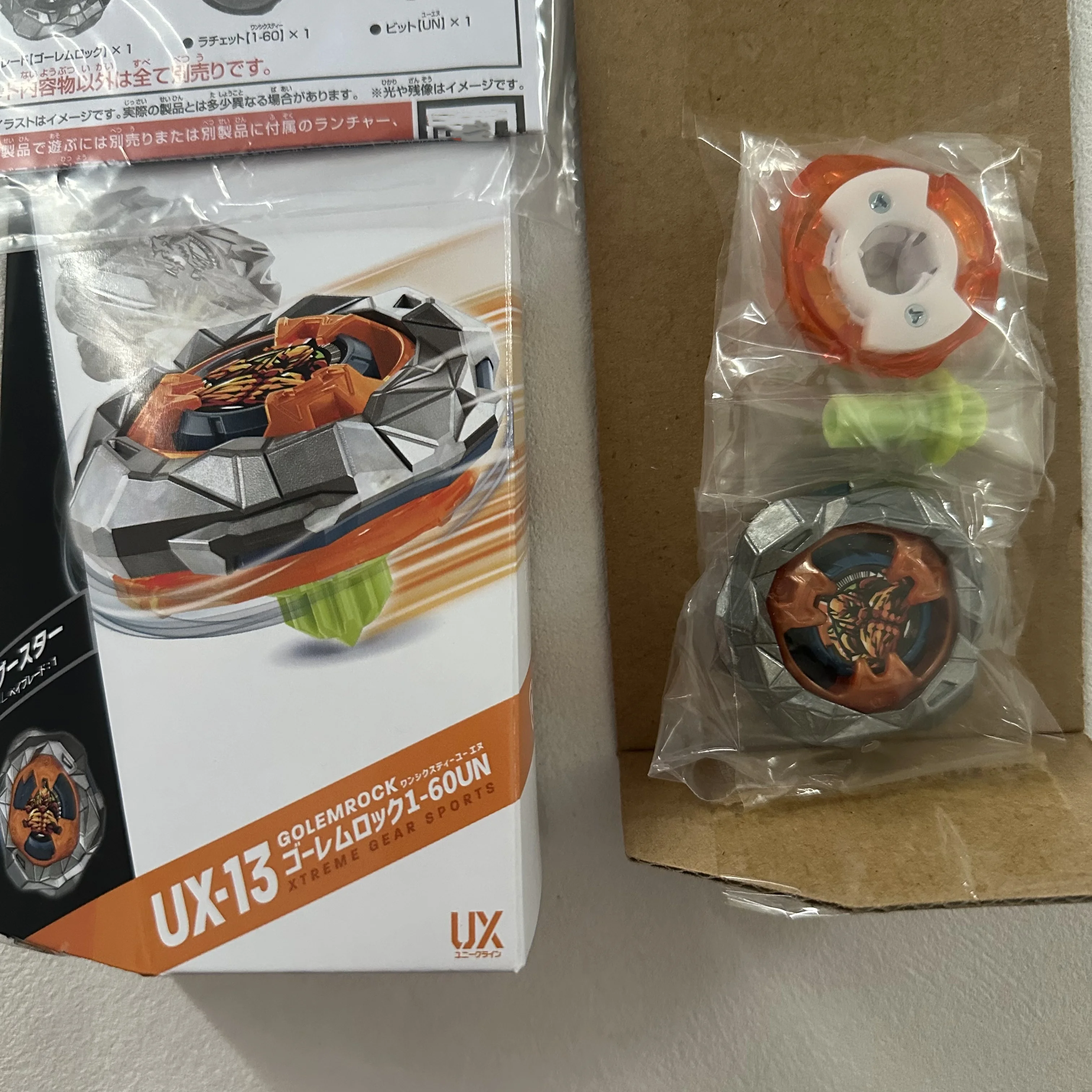BEYBLADE X UX-13 Booster Golem Rock 1-60UN – Peonza De Alto Rendimiento Con Diseño Metálico, Velocidad Extrema Y Efecto X-Dash, Requiere Lanzador Y Estadio (se Venden Por Separado)