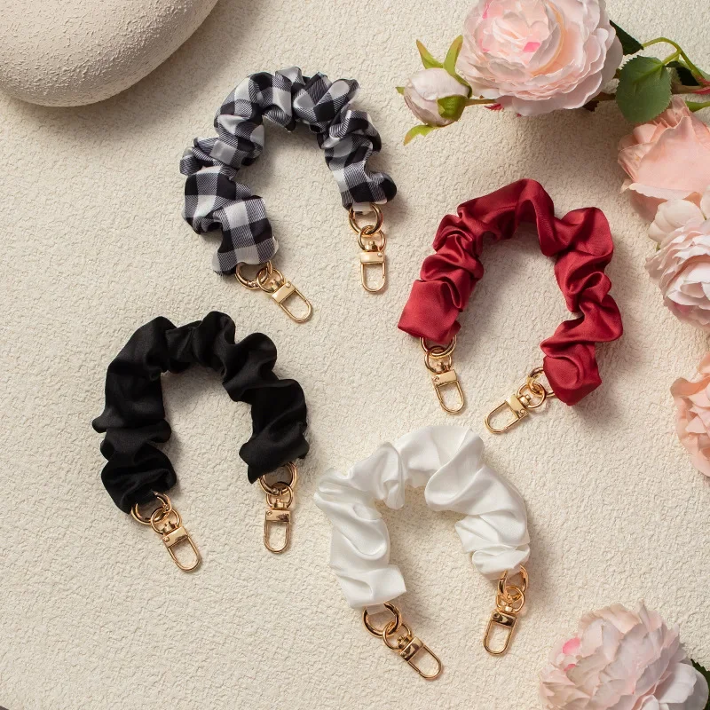 여자를위한 솔리드 컬러 전화 손목 스트랩 팔찌 여자 크리 에이 티브 Stretchable Scrunchy 모양 전화 매는 밧줄 휴대 전화 액세서리