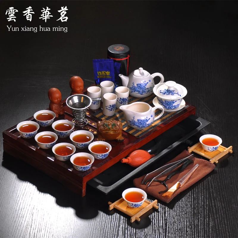 Kung fu tea set the whole kettle set of blue and white porcelain ceramic teapot solid wood tea tray ceremony tea cup tea ceremony tools tea set