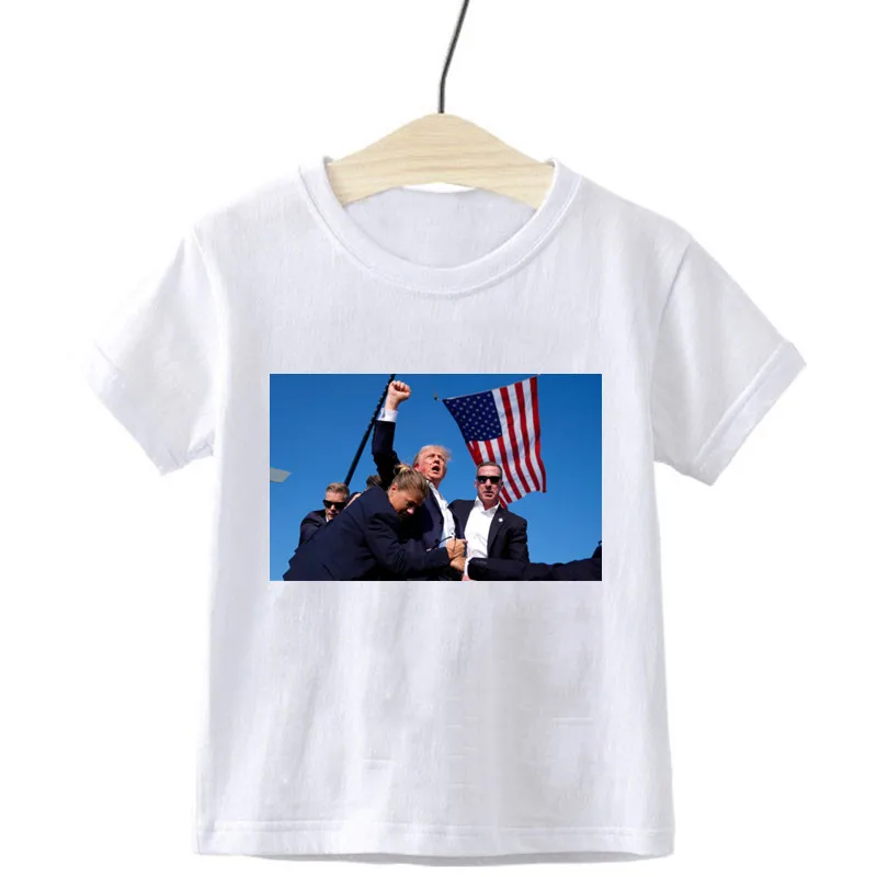 President Donald Trump argues with photos after children's t-shirt shot at his rally Trump Rally Shooter Tshirt