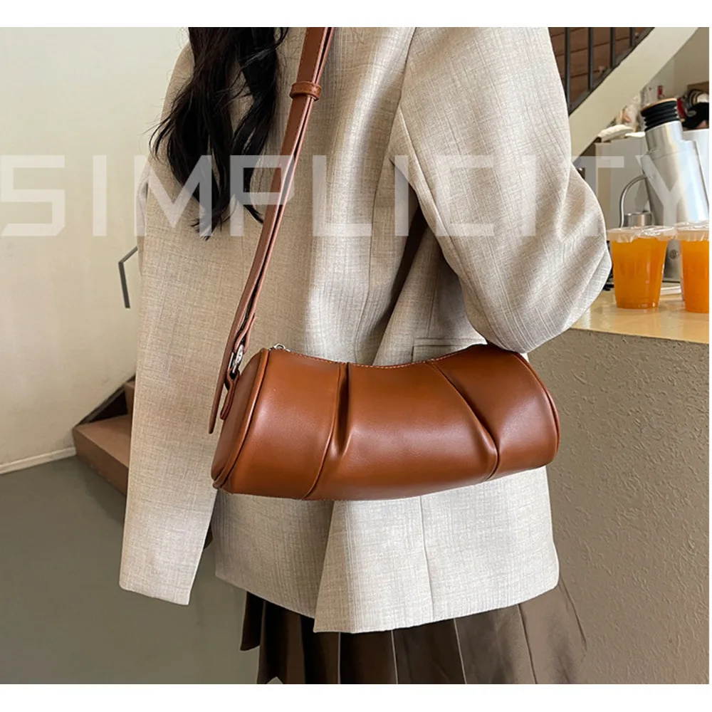 Korean version simple cylindrical women's 2024 new niche pillow versatile casual shoulder crossbody bag_voghion.com