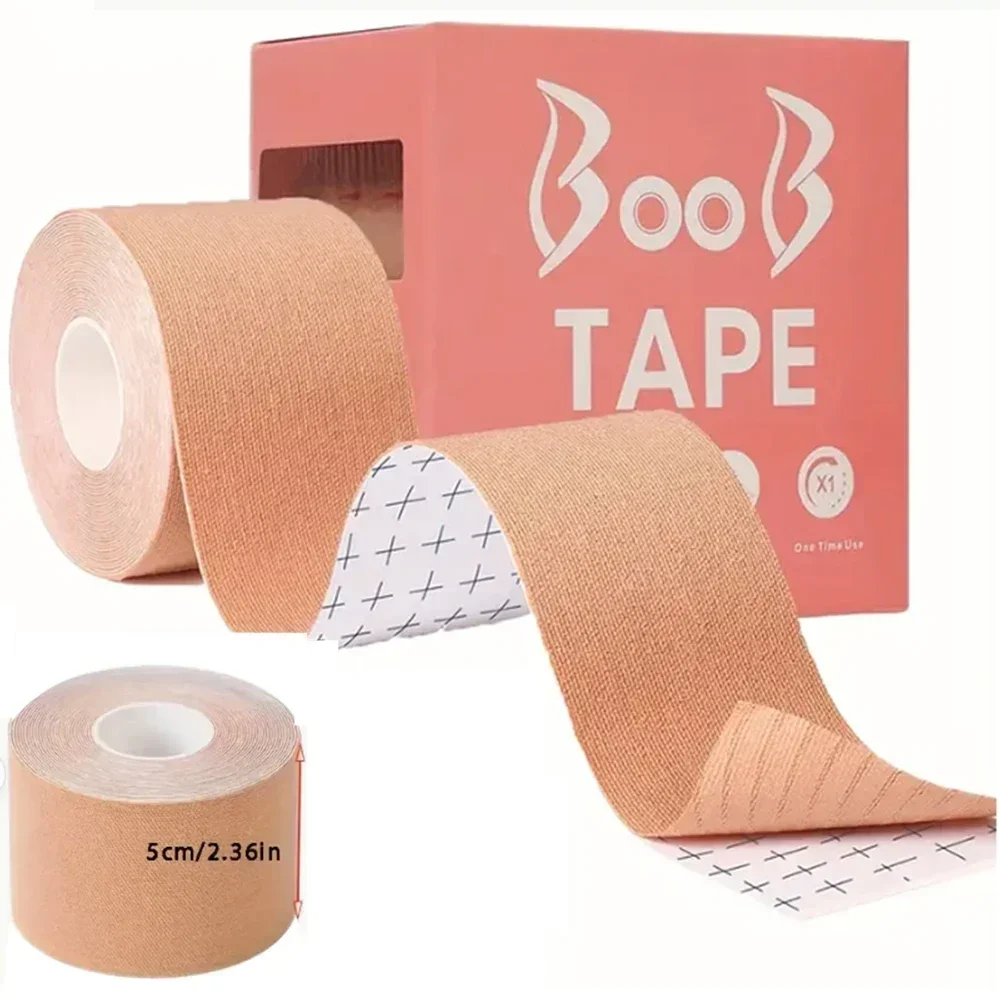 Close-up of nude "Boob Tape" product on white background, showing the rolled adhesive tape with grid backing paper, its minimalist pink-orange packaging box, and a detail shot highlighting its 5cm (2.36in) width.