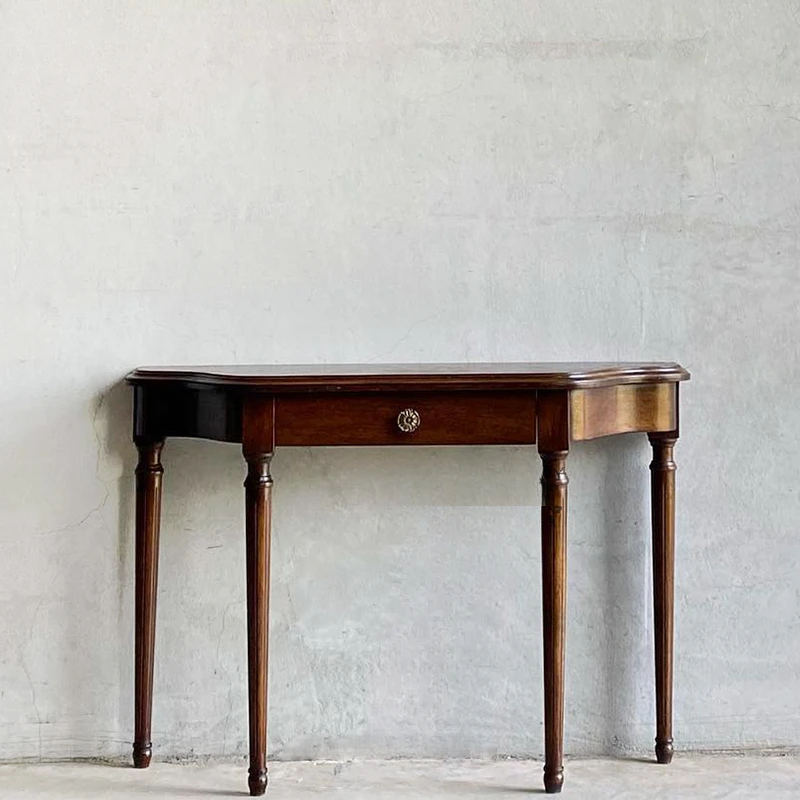 

Solid wood retro porch tables and cabinets are carved against the wall.