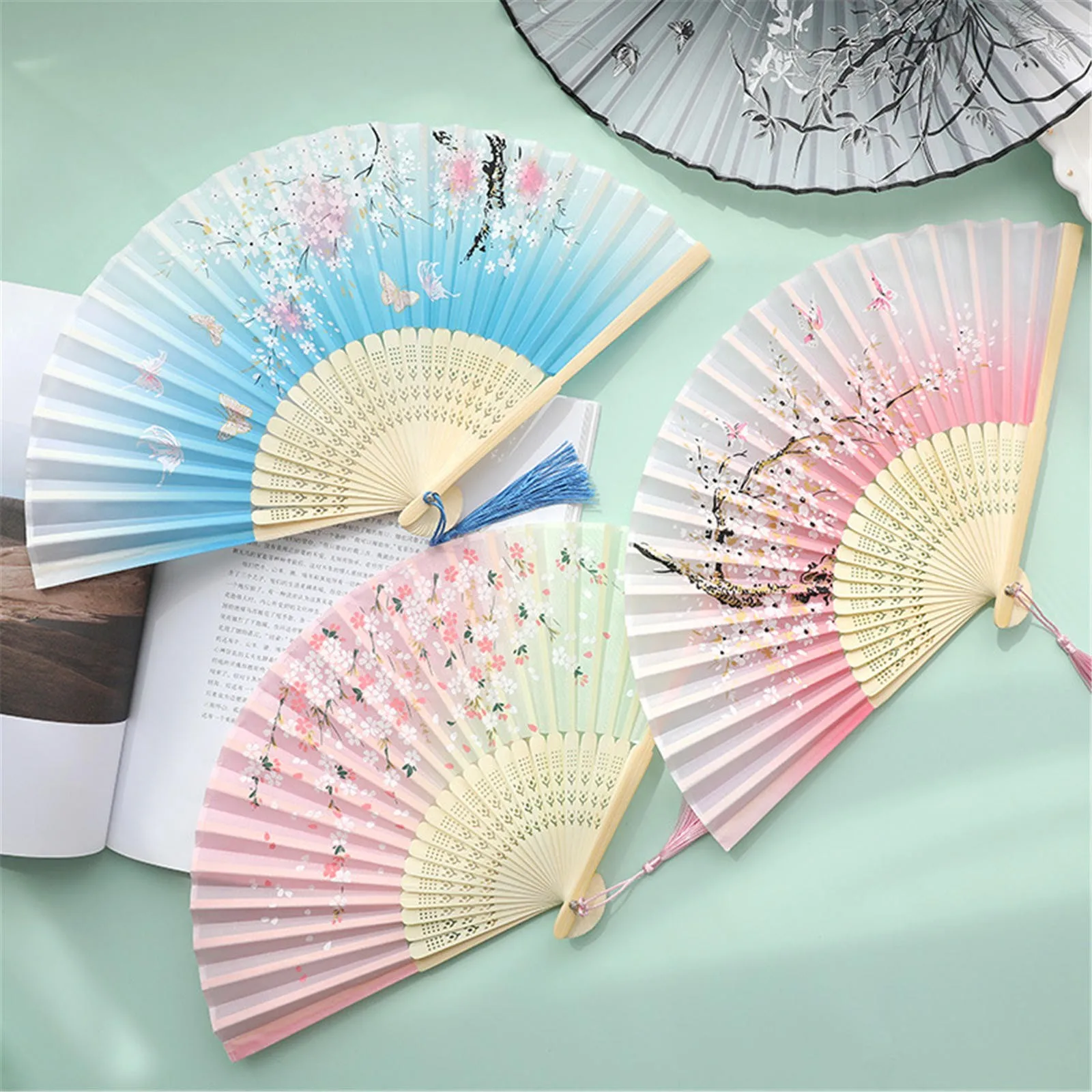 Folding Silk Bamboos Chinese Hand Fans Hollow Flower Printing Foldable folding-silk-bamboos-chinese-hand-fans-hollow-flower-printing-foldable