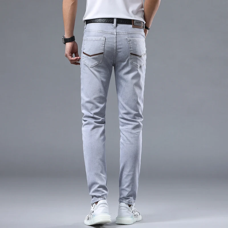 2024 spring new light gray jeans men's simple slim fit light luxury fashion version of the elastic match leisure pants