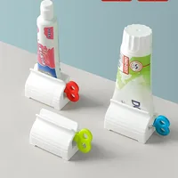 Toothpaste Squeezer Tooth Paste Holder Oral Care Bathroom Tools Tube Cosmetics Press Facial Cleanser Rolling Squeezing Dispenser 1