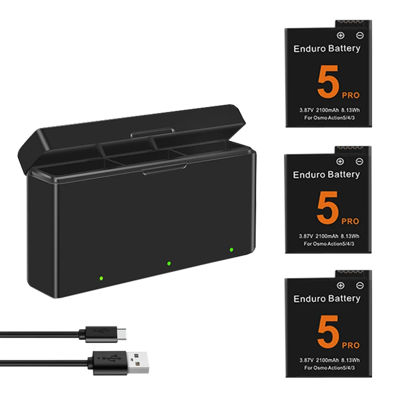 Battery and charger kit for DJI Osmo Action cameras laid out on a surface