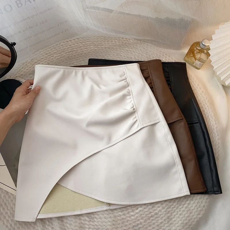 

2023 Asymmetrical Leather Skirts for Women Vintage Mini Skirt Office Lady Autumn PU Leather High Waist Korean Fashion Clothing