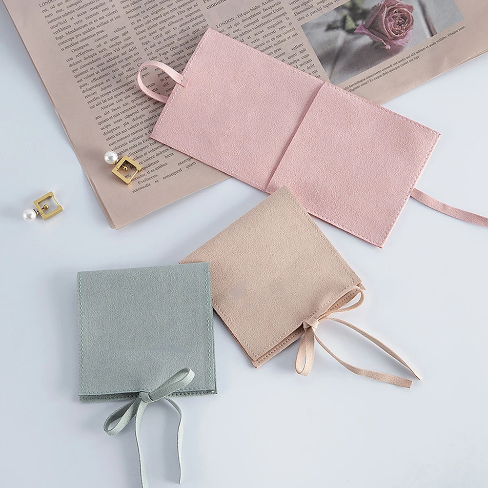

Wholesale Velvet Jewelry Storage Flip Pouches Wedding Ring Earrings Necklace Packaging Durable Portable Bags Customizable Logo