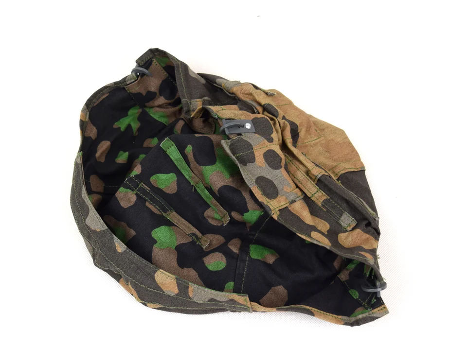 Casque camouflé allemand avec son filet de camouflage. | G.b.r