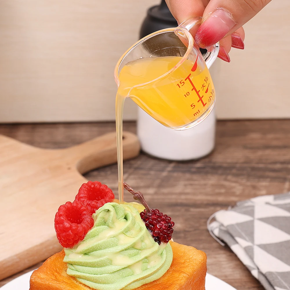 https://ae01.alicdn.com/kf/S6fc0e405928f41bfa994bd79350451efM/15ml-Mini-Scale-Measuring-Cup-Small-Transparent-Plastic-Quantitative-Cup-Kitchen-Seasoning-Cup-Lemon-Juice-Milk.jpg