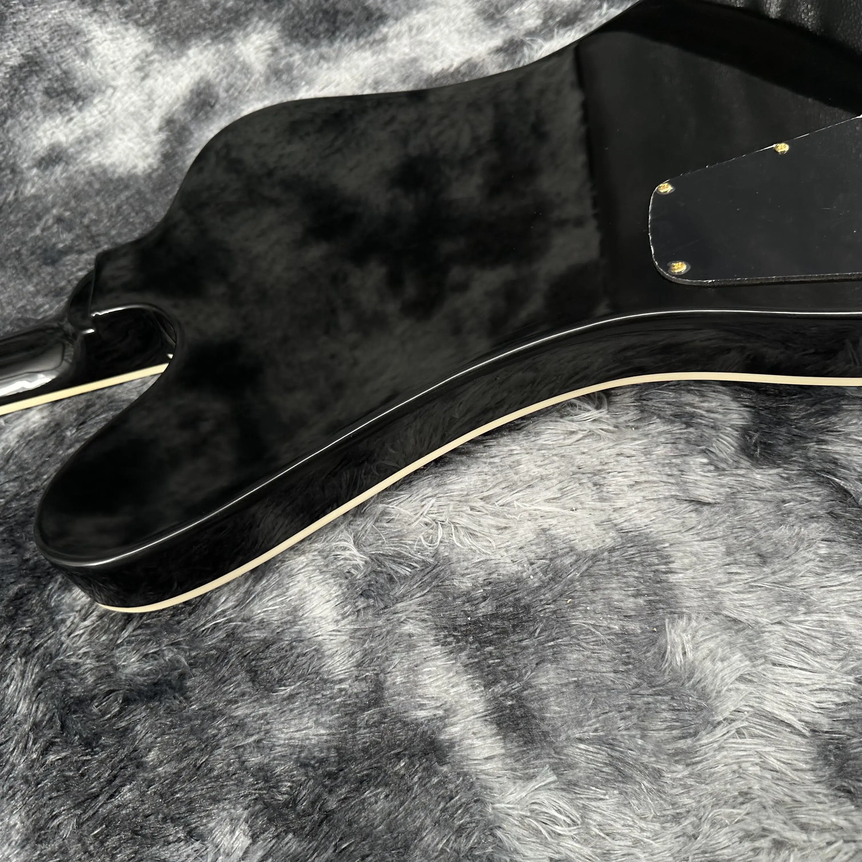 Firebird Black Electric Guitar with Electric Gold Accessories