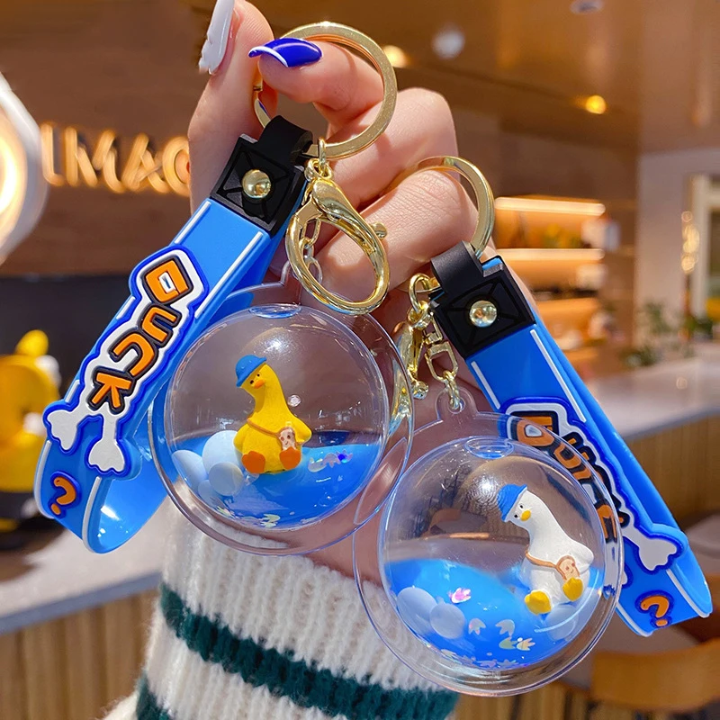 漫画アクリルボールにオイルフローティング傾いアヒル液体キーホルダー