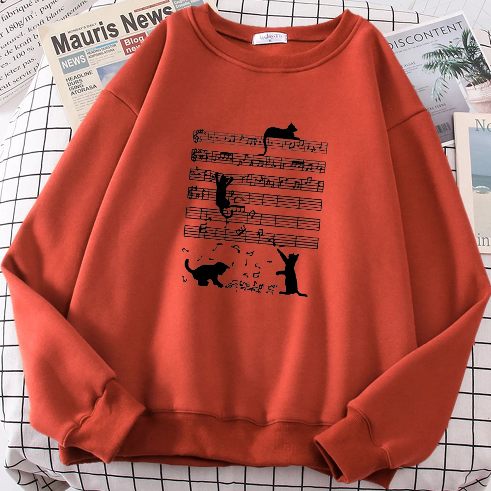 brick red cat mom sweatshirt with sheet music