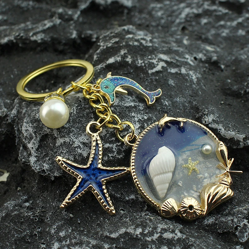 

Blue Ocean Keychain Starfish Dolphin Shell Dolphin Starfish Conch Dolphin Pearl Enamel Keychain Beautiful Beach Pendant Handmade