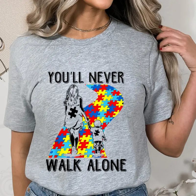 

You'll Never Walk Alone Letter Puzzle Piece T-shirt Kids Women Graphic Tee Kindness Shirt Aesthetic Summer Autism Awareness Tops