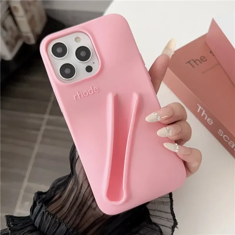 thumbnail image 1 of Estuche para teléfono de silicona suave con diseño de lápiz labial para iPhone 11, 12, 13, 14, 15 Pro Max, soporte portátil para brillo de labios Rhode Hailey, 1 of 4