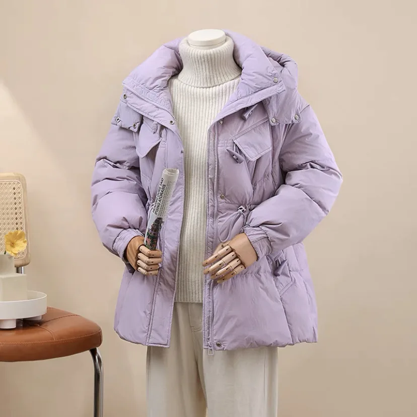 

Down jacket women's mid length 2023 winter new Korean version with waistband hooded fashionable white duck down jacket trend
