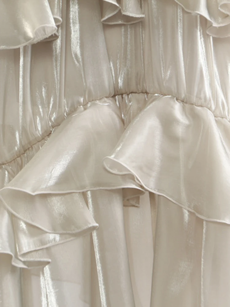 [EAM] High Elastic Waist Champagne Glossy Ruffles Irregular Half-body Skirt Women Fashion Tide New Spring Autumn 2026 1DJ0349