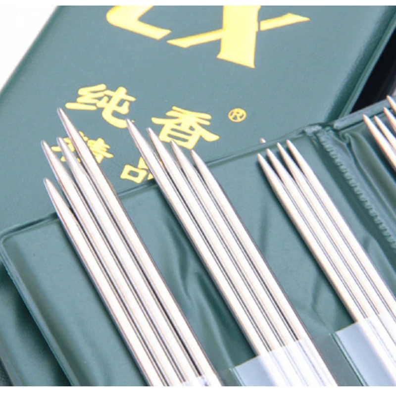 

Спицы или спицы для вязания, вязание, плетение, плетение, свитер, одежда и шерстяная ткань, шерстяная ткань