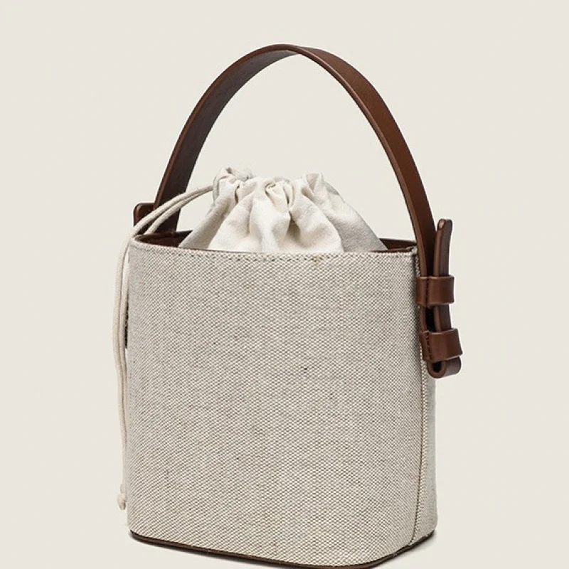 Women's canvas bucket bag, small slanted shoulder handbag, fashionable solid color, casual, going out for work and commuting
