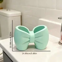A desktop decoration item, shaped like a macaron-colored bow, can be used as a pen holder. 6