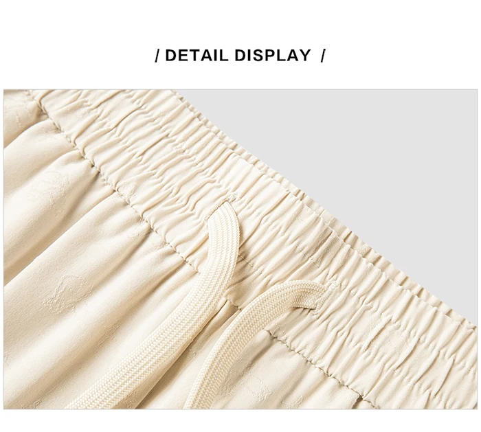 Pantalones casuales para mujer diseñados con un toque de textura. Pantalones cónicos de jacquard con estampado oscuro y un ajuste único y holgado.
