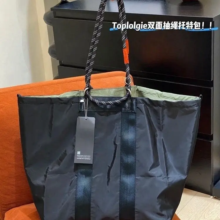 Nouveau sac fourre-tout léger, grande capacité, sac messager pour femmes, sac pour ordinateur léger et luxueux, sac de shopping imperméable pour les trajets quotidiens. 1 Nouveau sac fourre-tout léger, grande capacité, sac messager pour femmes, sac pour ordinateur léger et luxueux, sac de shopping imperméable pour les trajets quotidiens. 1