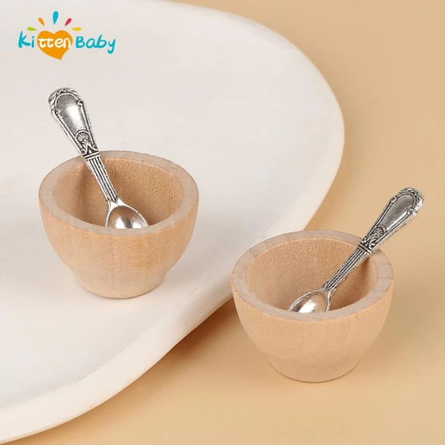 small wooden bowl with wooden baby spoon