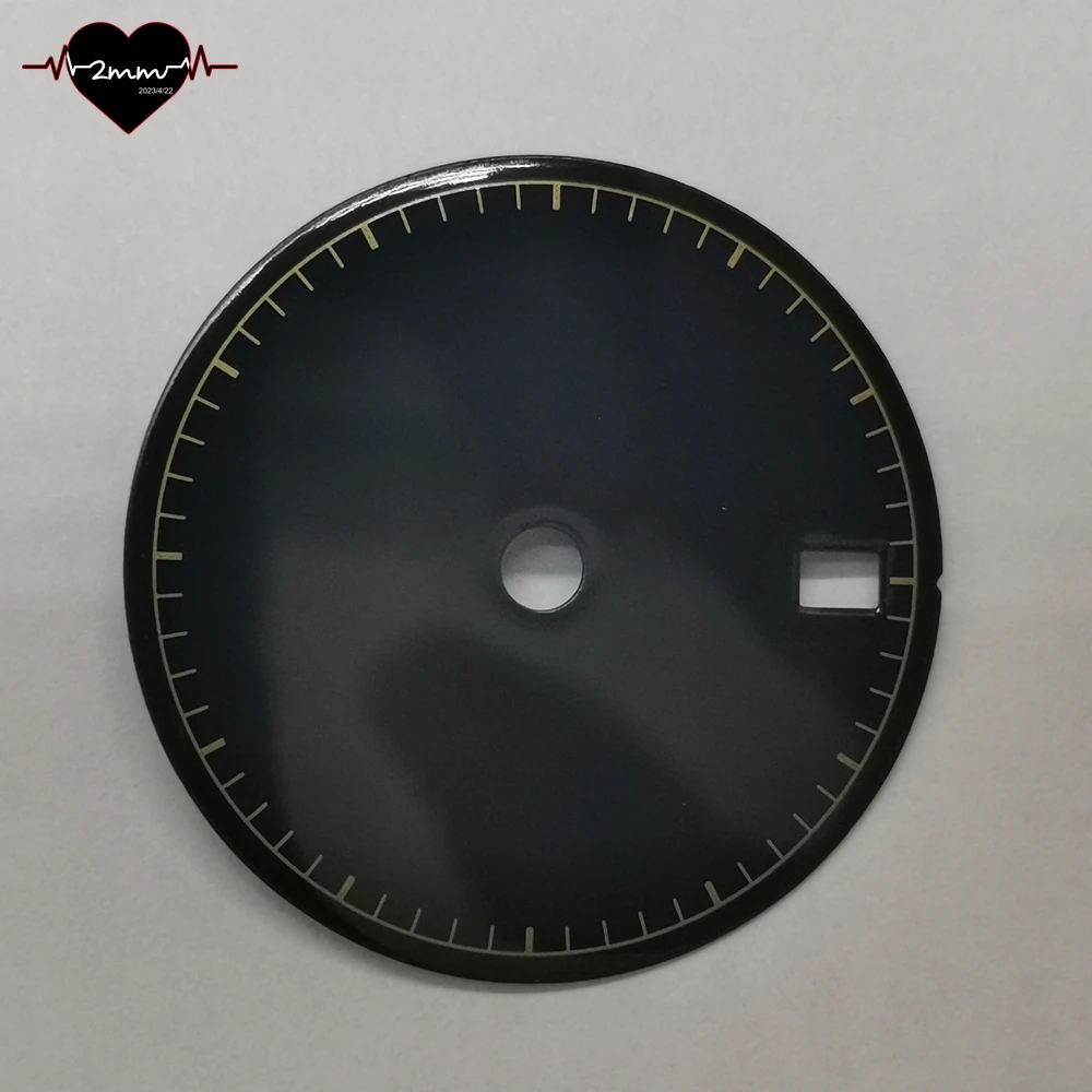 Glossy Matte Black Watch Dial with Gold Accents and Date Window