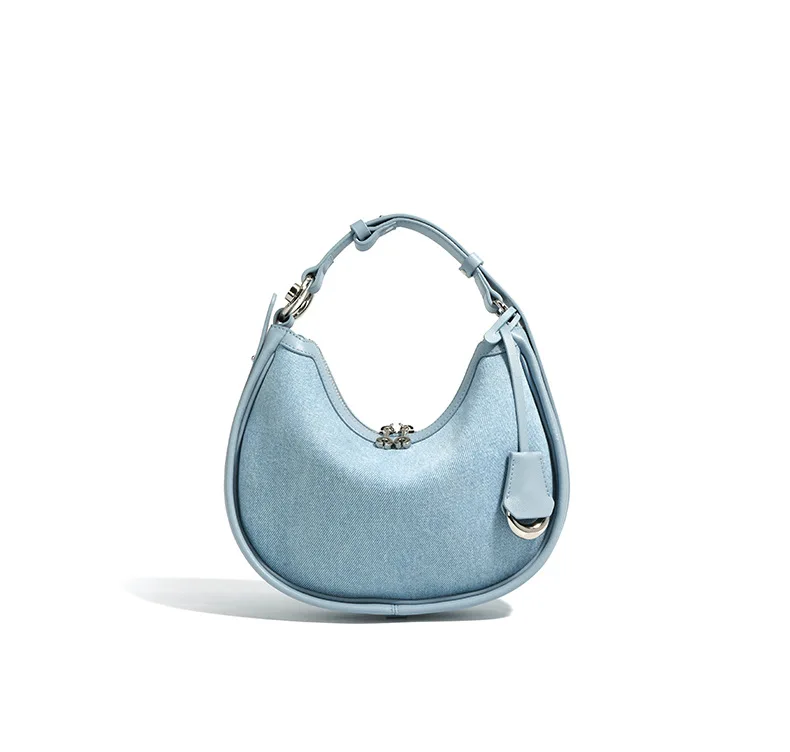 Half moon shoulder bag made of denim with genuine leather trim – casual and stylish design for daily use.