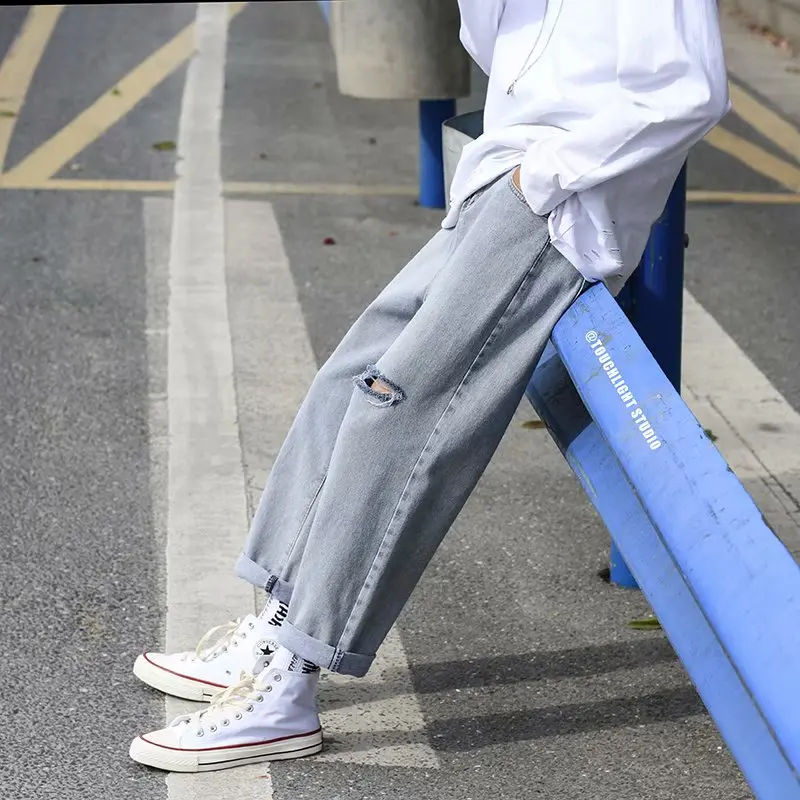 

Spring and summer tide brand trend ripped denim trousers men's straight nine points light colored pants 100 match wide leg