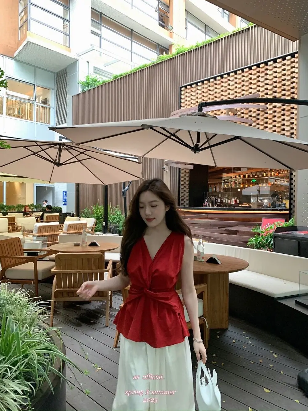 Image of Designer Twist Knot V-neck Vest for Women 2025 Summer New Resort Style Niche Slim-fit Unique Sleeveless Top