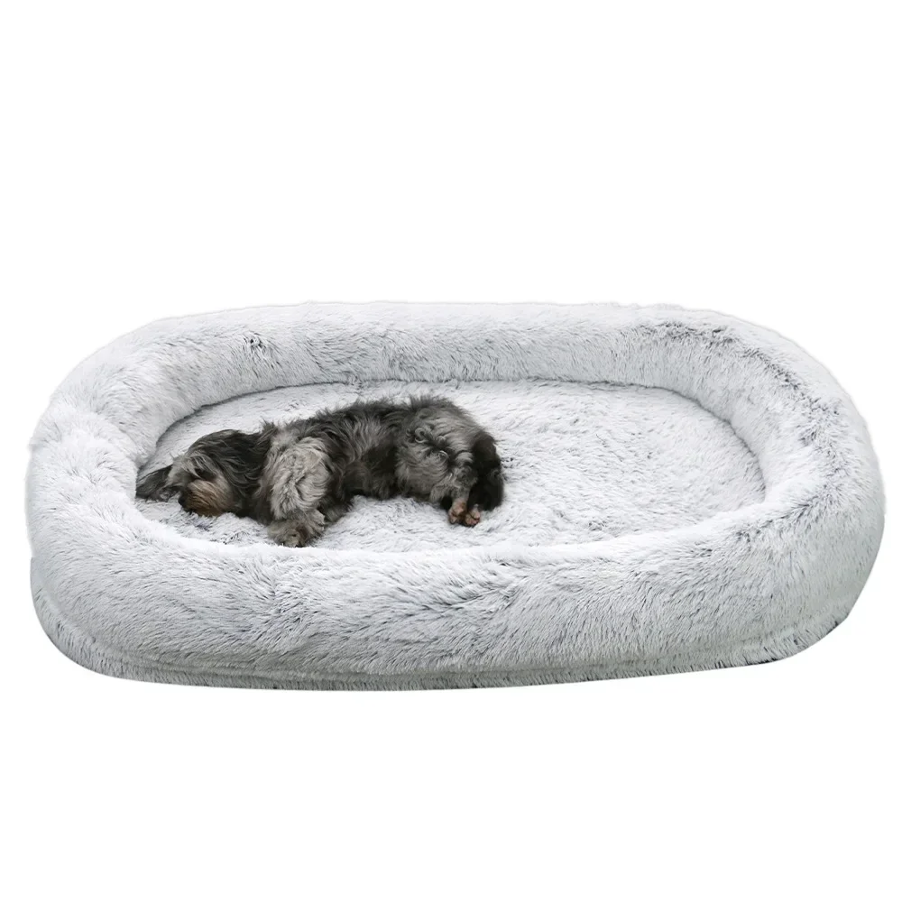 A giant plush sponge dog bed for human use to keep warm in winter as a pet bed. People and dogs share leisure mattresses