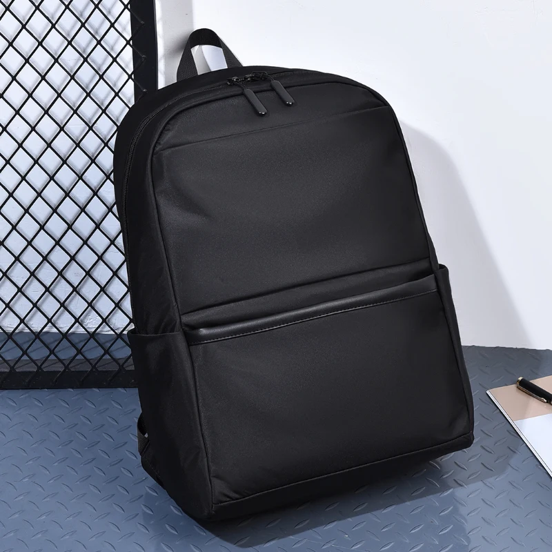 Men's large capacity laptop backpack with adjustable shoulder straps, durable for travel and school