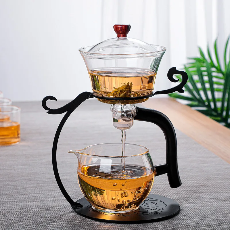 https://ae01.alicdn.com/kf/S732389d2be4449a4a80de9c5b0a7d461q/Lazy-tea-maker-palace-lantern-automatic-tea-set-wooden-frame-glass-mug-glass-teapot-tea-set.jpg