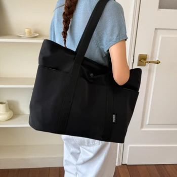 Borsa tote in tela casual, alla moda e di tendenza, con grande capacità, leggera, ideale per il pendolarismo, dal design semplice.