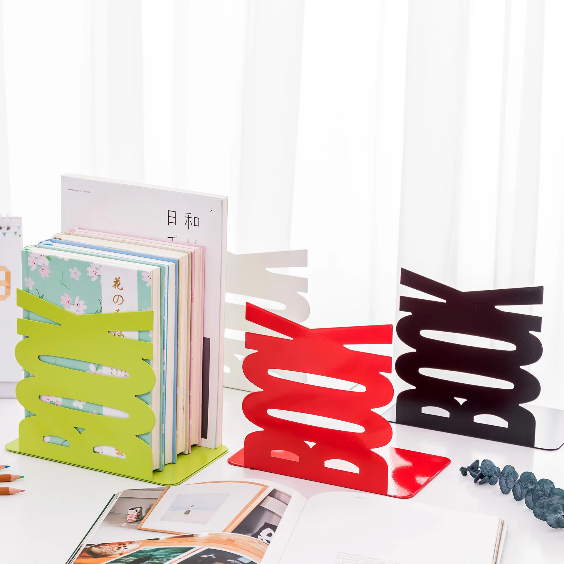 

Adjustable Metal Bookends for Shelves, Desk and Office Table Is Folded and Stored Against The Book Shield
