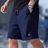 Shorts de sport décontractés pour hommes, à carreaux, amples, longueur genou, style américain, mode sportive urbaine 4