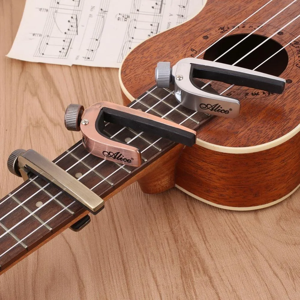 Capos Per Chitarra Chitarra Acustica Elettrica Capo Bass Violino Ukulele Capotraste Single-Handed Tune Clamp Trigger 3 Colori Metallo Capo