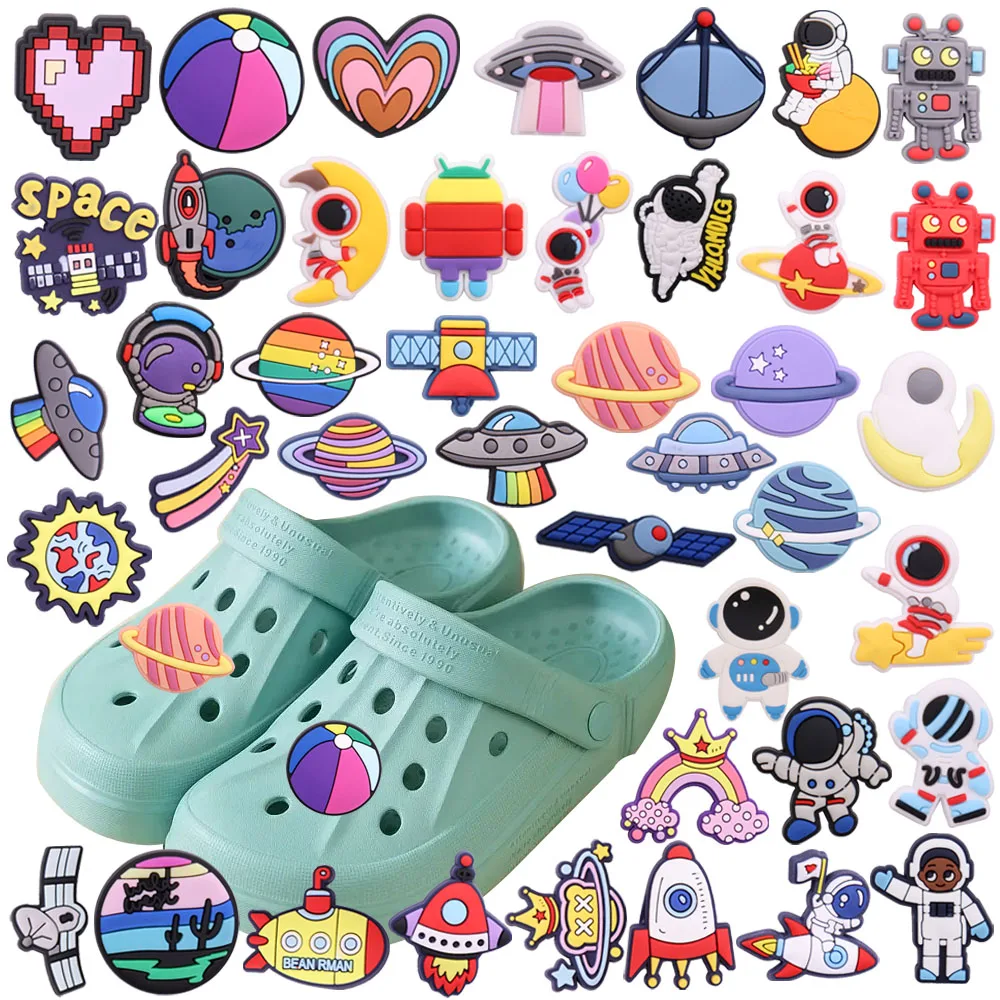 

Mix 50Pcs PVC Croc Charms Rocket Planet Rainbow Astronaut Robot Heart Ball UFO Antennae Garden Shoes Button Decorations
