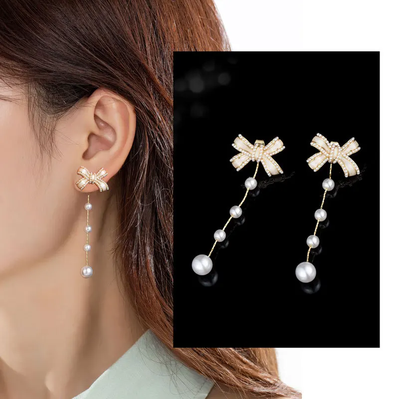 

Long Pearl Bow Earrings Spring and Summer New Niche High-grade Fringe Earrings S925 Silver Needle Explosion Earrings