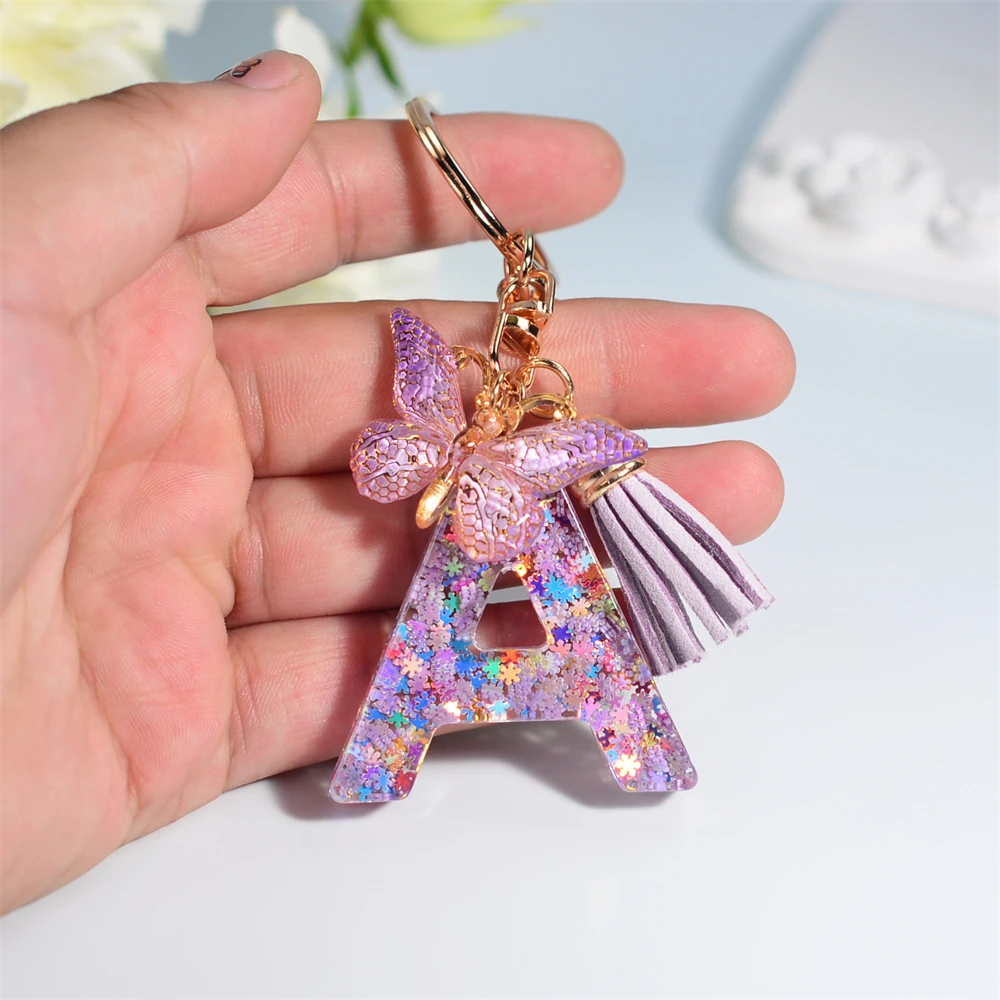 https://ae01.alicdn.com/kf/S752c3135cd9046fc97ed8f4e6e25d543Z/Classic-Snowflakes-26-Letters-Keychain-Pink-Purple-Resin-Initial-Alphabet-Keyrings-With-Butterfly-Tassel-For-Women.jpg