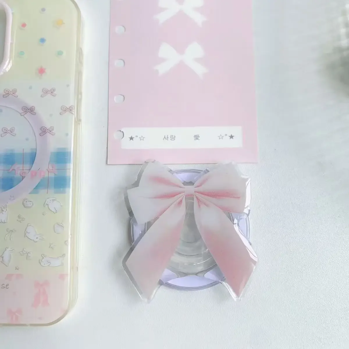 새로운 디자인 활 모양의 마그네틱 브래킷 귀여운 전화 에어백 백 스티커 강력한 흡입 Magsafe 데스크탑 지원 브래킷