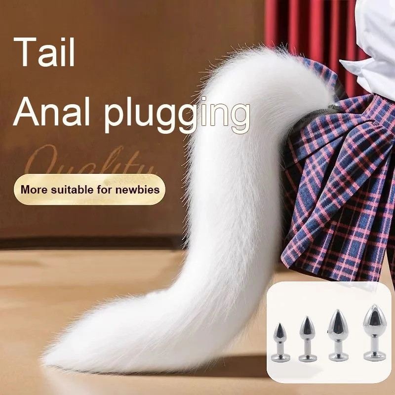 Silver metal fox tail anal plug shown upright